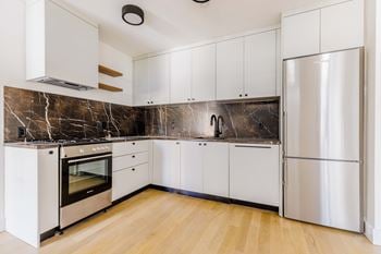 Modern kitchen with dark marble backsplash